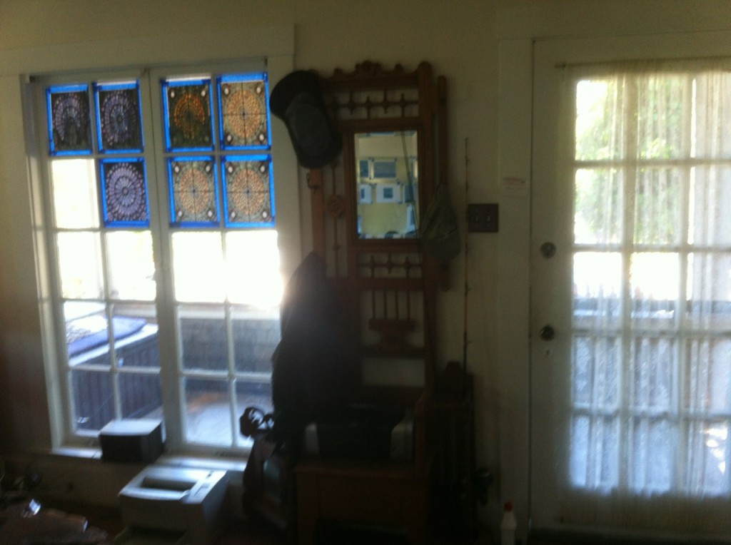 View from the living room of the front windows and door