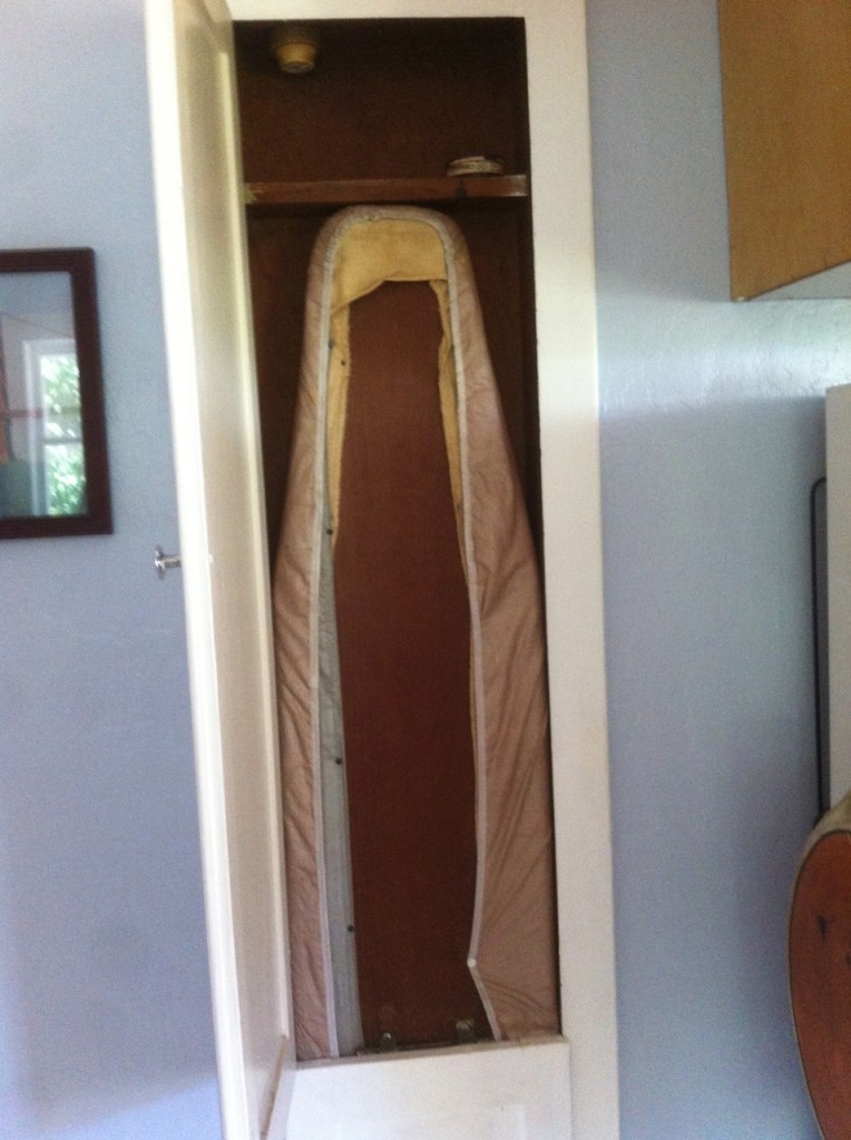 Ironing Board in its own closet next to the refrigerator!