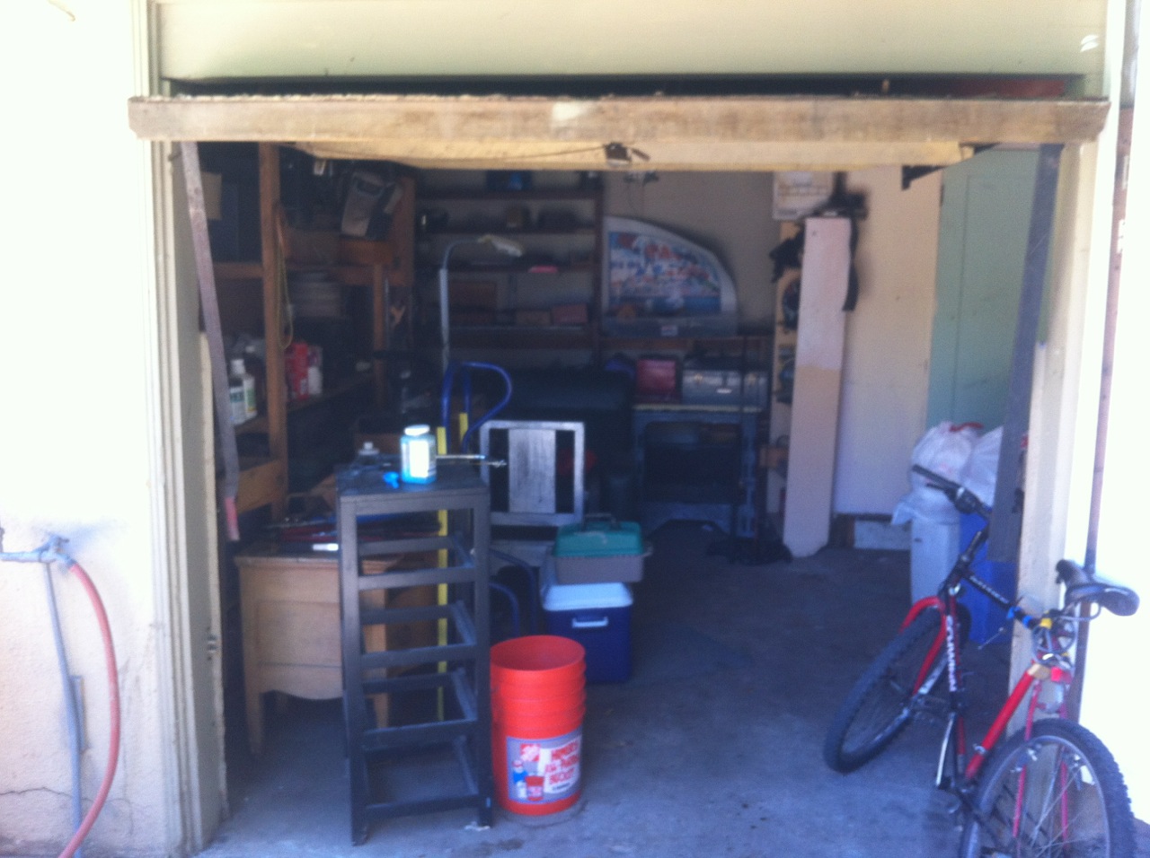 One car garage in the back of the house