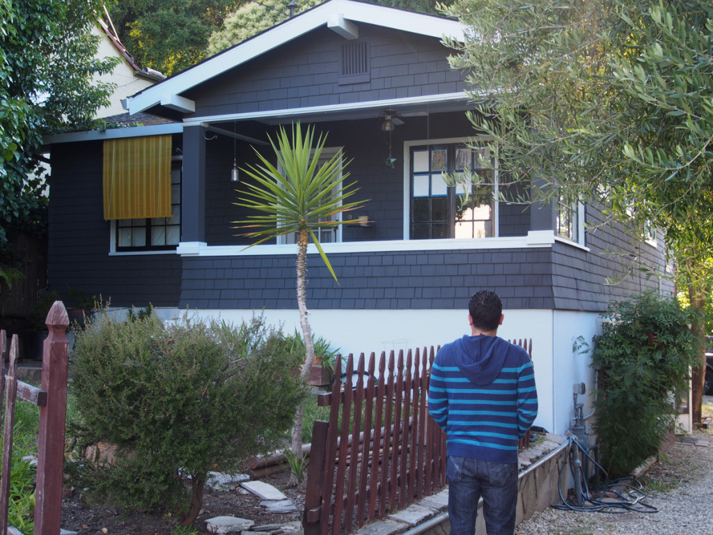 Kerem looking longingly at his new house
