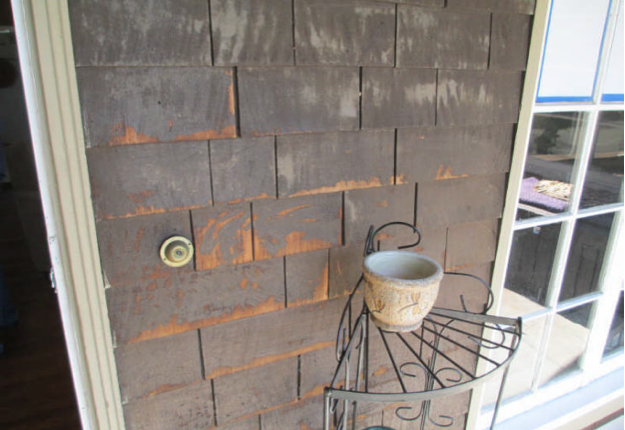 The peeling paint by the front door
